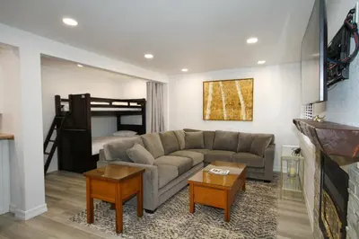 a living room with a couch and a bed at Mammoth Ski Racquet Club 127 in Mammoth Lakes
