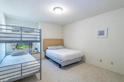 a bedroom with two beds and a bunk bed at Spectacular Views w/ Hot Tub/BBQ -Yosemite & Bass Lake in Oakhurst
