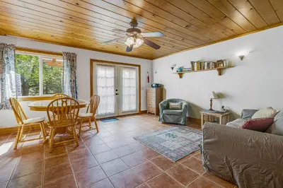a living room with a table and a couch at Yosemite Mountain Cottage in Groveland