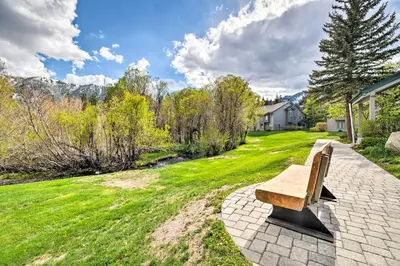 a bench sitting on a brick walkway in a yard at Hot Tub Access Mammoth Lakes Nature Escape! in Mammoth Lakes