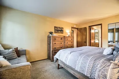 a bedroom with a bed and a dresser at Hot Tub Access Mammoth Lakes Nature Escape! in Mammoth Lakes