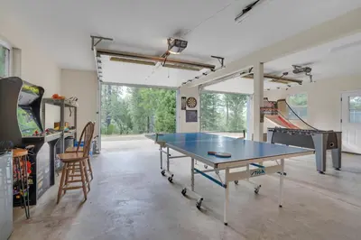 a room with a ping pong table in it at Moonrise Lodge - A Large Vacation Home in Mariposa in Mariposa