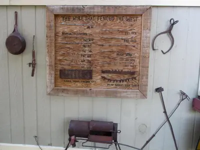 a sign on a wall with a chair next to it at Virginia City Inn in Virginia City