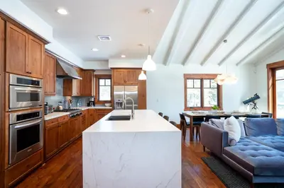a kitchen and living room with a couch and a table at Annie's Loop, Gray's Crossing 10215 in Truckee