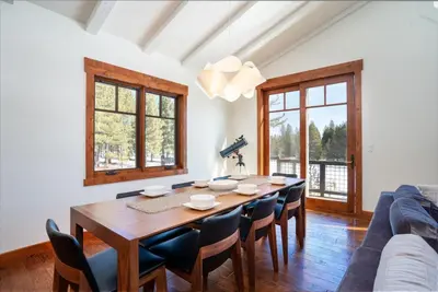 a dining room with a table and chairs at Annie's Loop, Gray's Crossing 10215 in Truckee