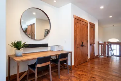 a dining room with a table and a mirror at Annie's Loop, Gray's Crossing 10215 in Truckee