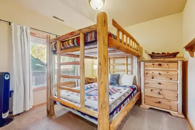 a bedroom with two bunk beds and a dresser at Truckee Treat in Truckee