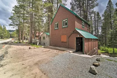 a house in the middle of a dirt lot at Half-Mi to Trails Rustic Soda Springs Cabin! in Soda Springs