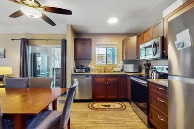 a kitchen with a table and a dining room at 11529 Snowpeak Way #619 in Truckee