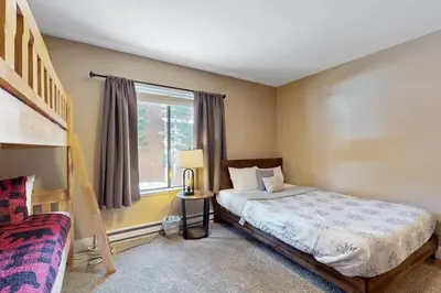 a bedroom with a bed and a window at 11529 Snowpeak Way #619 in Truckee