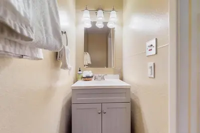 a bathroom with a sink and a mirror at 11529 Snowpeak Way #619 in Truckee