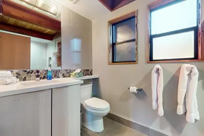 a bathroom with a toilet and a sink at Hammock Holidays in Truckee