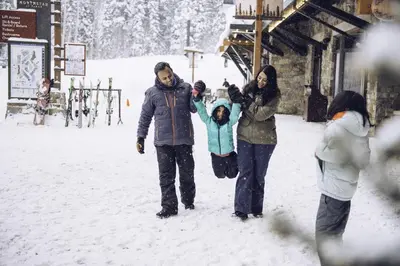 a group of people standing in the snow at Modern Hotel-Style Studio - Timber Creek Lodge #210 Hotel Room in Truckee