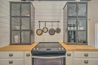 a kitchen with a stove and some pots and pans at Cold Springs Escape AandC, Hot Tub, Generator, WiFi in Cold Springs
