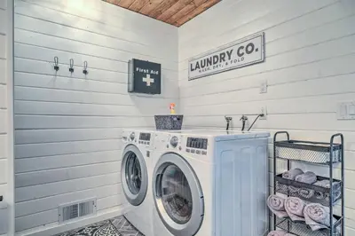 a laundry room with a washer and dryer at Cold Springs Escape AandC, Hot Tub, Generator, WiFi in Cold Springs