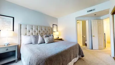 a bedroom with a large bed with a large headboard at Silver Bear #21 condo in Mammoth Lakes