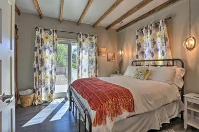 a bedroom with a bed and a window at Sierra Sunset Inn - 3 Miles to Placerville! in Placerville