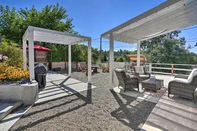 a patio with chairs and a pergola and a grill at Sierra Sunset Inn - 3 Miles to Placerville! in Placerville