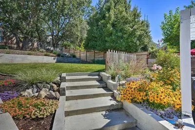 a garden with stairs and flowers in a yard at Sierra Sunset Inn - 3 Miles to Placerville! in Placerville