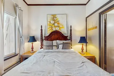 a bedroom with a large bed with two lamps at Lakeside Dreamzzz in Tahoe Vista