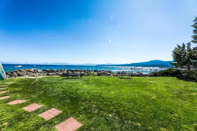 a park with benches and a view of the ocean at Lakeside Dreamzzz in Tahoe Vista