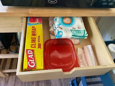 a drawer in a desk with a box and a suitcase at Private 1 Bd near Yosemite and Bass lake in Oakhurst