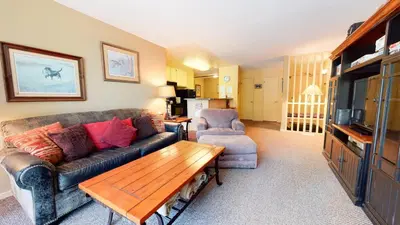 a living room with a couch and a table at Crestview #25 condo in Mammoth Lakes