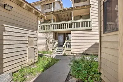 a apartment building with a balcony and a walkway at Cozy Family Condo in Mammoth Lakes with Balcony in Mammoth Lakes