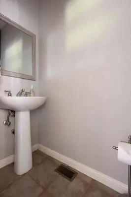 a white bathroom with a sink and a mirror at Fraser Family Vineyard Estate Pet-Friendly Home in Plymouth