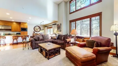 a living room with a couch and a table at Timbers #10 townhouse in Mammoth Lakes