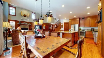 a kitchen and dining room with a wooden table at Timbers #10 townhouse in Mammoth Lakes