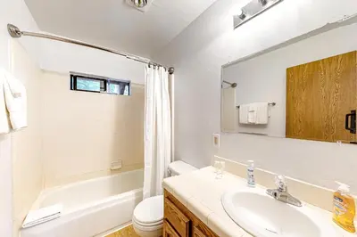 a bathroom with a sink and a toilet and a tub at Sierra Dream in South Lake Tahoe