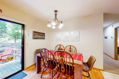 a dining room with a table and chairs at Relax on Pretoria in Carnelian Bay