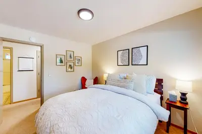 a bedroom with a large white bed in it at Relax on Pretoria in Carnelian Bay