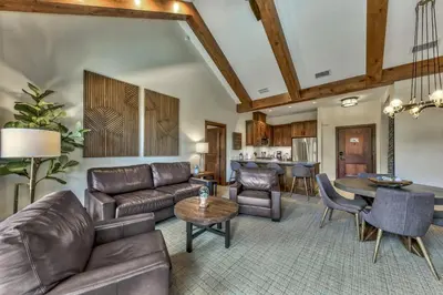 a living room with leather furniture and a table at Luxury Two Bedroom Residence steps from Heavenly Village condo in South Lake Tahoe