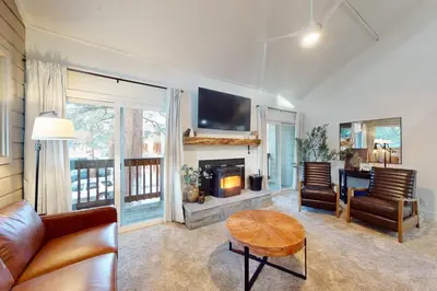 a living room with a couch and a table at La Residence 8 in Mammoth Lakes