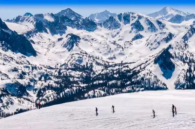 a group of people skiing down a snow covered mountain at Creekhouse 1332 in Mammoth Lakes