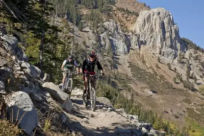 two people riding bikes on a mountain trail at Snowcreek 791 in Mammoth Lakes