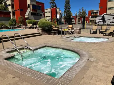 a hot tub in the middle of a courtyard at Condos 1849 #102 in Mammoth Lakes