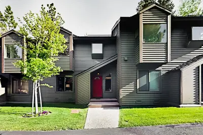 a black house with a red door at Forest Creek 12 in Mammoth Lakes
