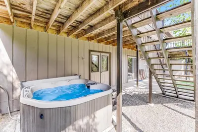 a hot tub in a house with a roof at Harvest Moon Hideaway in Groveland