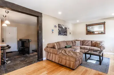 a living room with a couch and a table at Mammoth Ski Racquet Club 32 - Newly Remodeled Pet Friendly in Mammoth Lakes