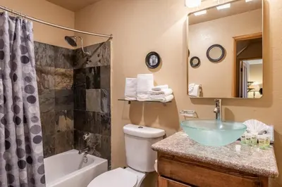 a bathroom with a sink and a toilet and a shower at Mammoth Ski Racquet Club 32 - Newly Remodeled Pet Friendly in Mammoth Lakes