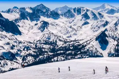 a group of people skiing down a snow covered mountain at Mammoth View Villas 24 in Mammoth Lakes