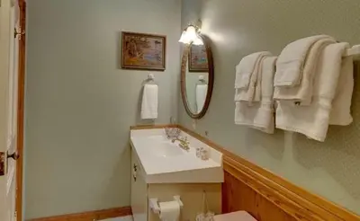 a bathroom with a sink and a mirror at Mariposa Hotel Inn in Mariposa