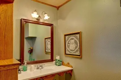 a bathroom with a sink and a mirror at Mariposa Hotel Inn in Mariposa