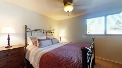 a bedroom with a bed and a window at San Sierra #26 condo in Mammoth Lakes