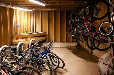 a group of bikes parked in a garage at St Anton Courtyard View 2-Bedroom Condos with two oversized jacuzzi spas in Mammoth Lakes
