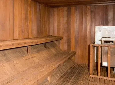 a empty wooden room with a wooden bench in a room at St Anton Courtyard View 2-Bedroom Condos with two oversized jacuzzi spas in Mammoth Lakes