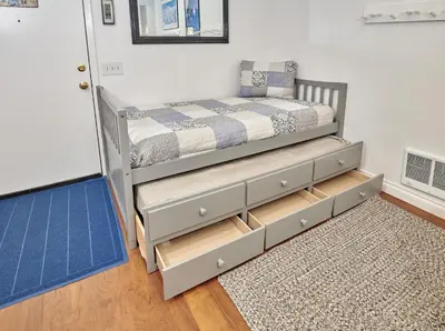 a bedroom with a bunk bed with wooden drawers at St Anton Condos with Rec Center in Mammoth Lakes